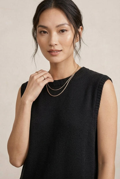 A woman wearing the LOHNR Slouch Tunic Set in Onyx black, a premium sleeveless loungewear set with a relaxed fit.