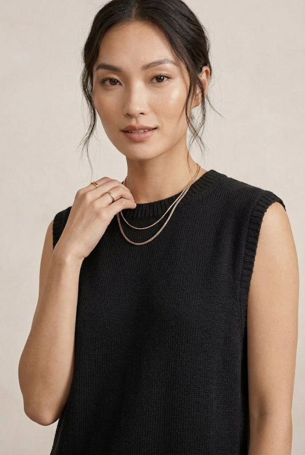 A woman wearing the LOHNR Slouch Tunic Set in Onyx black, a premium sleeveless loungewear set with a relaxed fit.