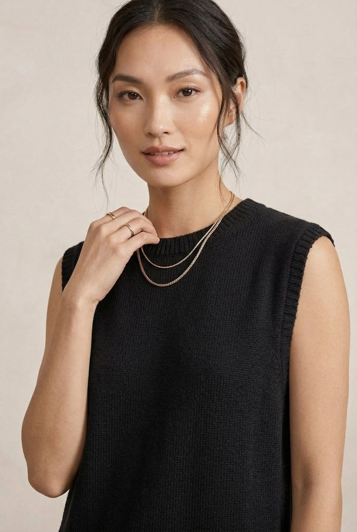 A woman wearing the LOHNR Slouch Tunic Set in Onyx black, a premium sleeveless loungewear set with a relaxed fit.