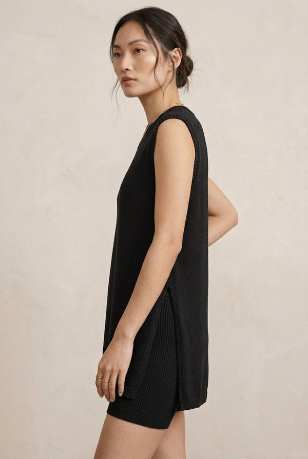 A woman wearing the LOHNR Slouch Tunic Set in Onyx black, a premium sleeveless loungewear set with a relaxed fit.