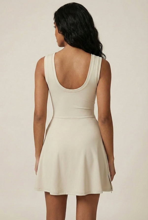 LOHNR The Rally Dress in Beige - Athletic one-piece romper with side-tie wrap skirt and hidden integrated shorts