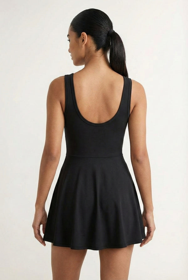 LOHNR The Rally Dress in Black - Athletic one-piece romper with side-tie wrap skirt and hidden integrated shorts