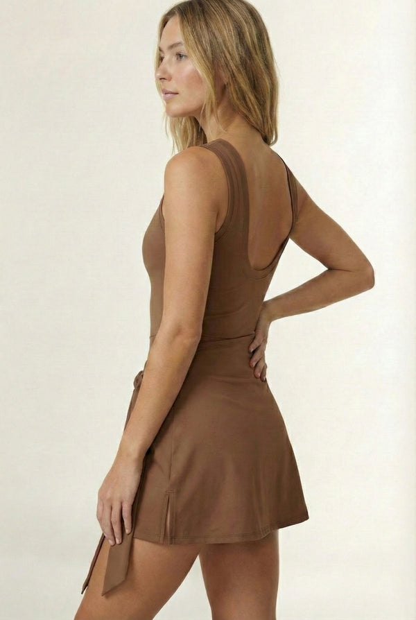 LOHNR The Rally Dress in Brown - Athletic one-piece romper with side-tie wrap skirt and hidden integrated shorts