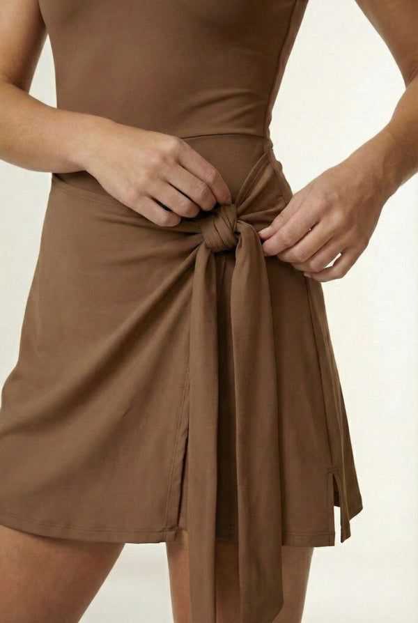 LOHNR The Rally Dress in Brown - Athletic one-piece romper with side-tie wrap skirt and hidden integrated shorts