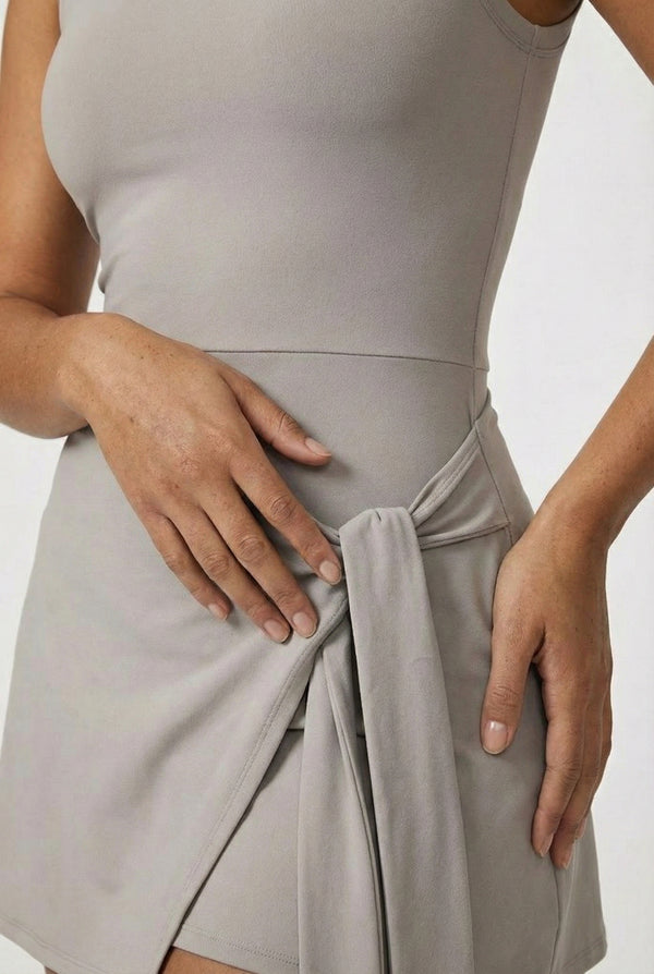 LOHNR The Rally Dress in Gray - Athletic one-piece romper with side-tie wrap skirt and hidden integrated shorts