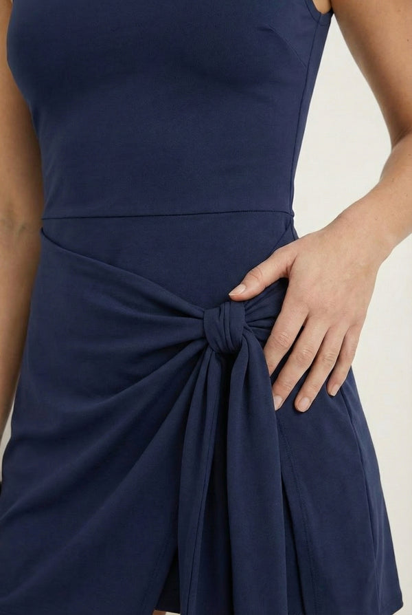 LOHNR The Rally Dress in Navy Blue - Athletic one-piece romper with side-tie wrap skirt and hidden integrated shorts