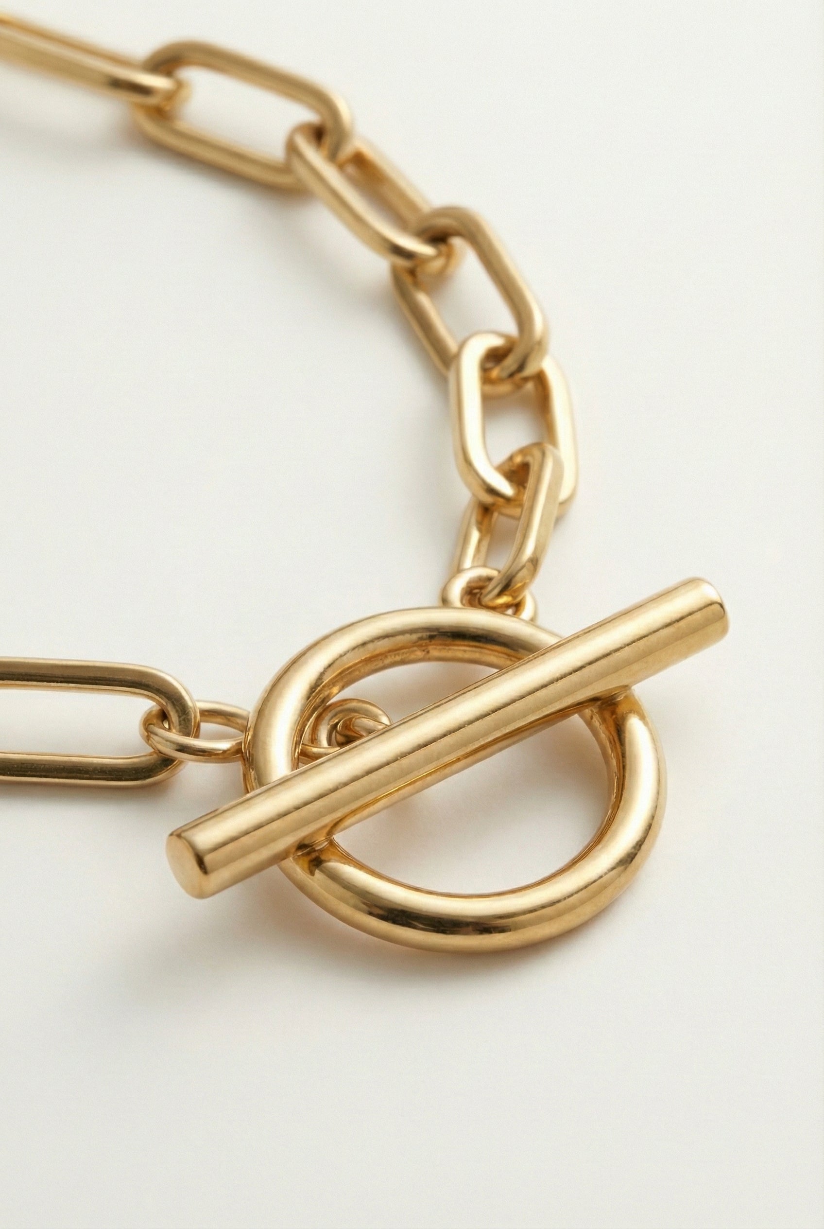 LOHNR The Uniform Chain in Brushed Gold. A premium 18k gold plated paperclip choker necklace featuring a clean toggle closure.