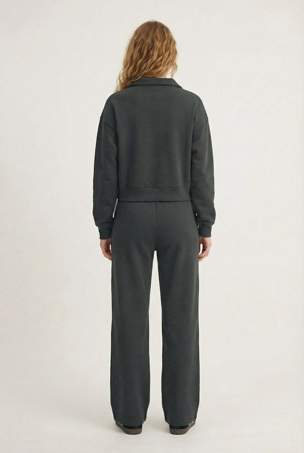 Model wearing the LOHNR Ventura Set in Onyx, a premium soft scuba matching set featuring a sculpted V-neck and wide-leg pants for refined comfort.