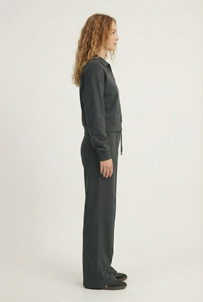 Model wearing the LOHNR Ventura Set in Onyx, a premium soft scuba matching set featuring a sculpted V-neck and wide-leg pants for refined comfort.