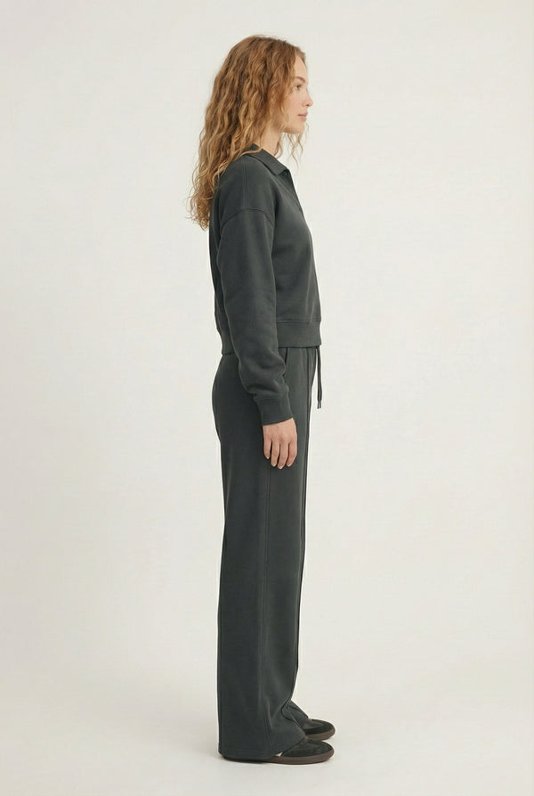 Model wearing the LOHNR Ventura Set in Onyx, a premium soft scuba matching set featuring a sculpted V-neck and wide-leg pants for refined comfort.