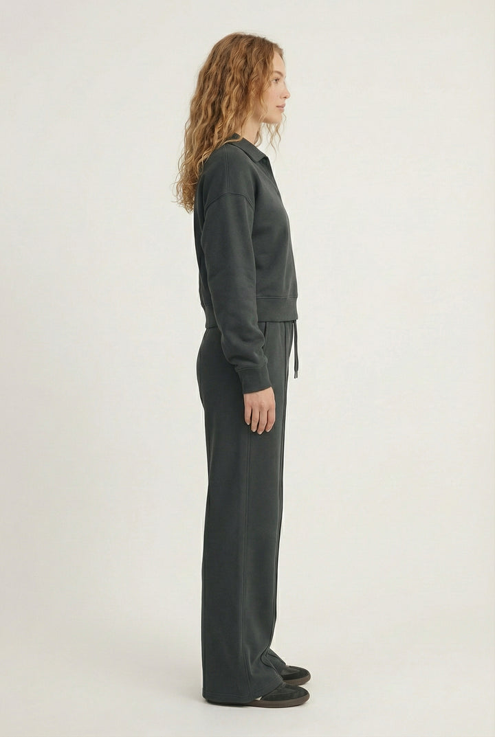Model wearing the LOHNR Ventura Set in Onyx, a premium soft scuba matching set featuring a sculpted V-neck and wide-leg pants for refined comfort.