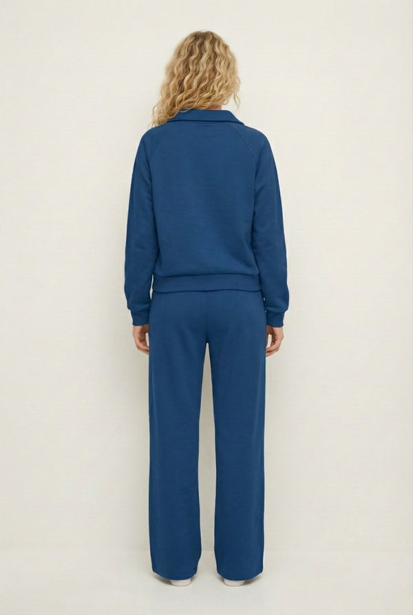 Model wearing the LOHNR Ventura Set in Slate, a premium soft scuba matching set featuring a sculpted V-neck and wide-leg pants for refined comfort.