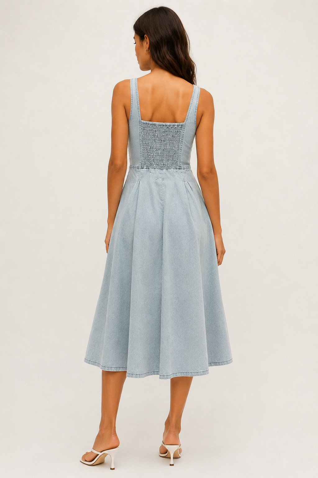 Woman wearing the Lohnr Vivienne Bustier Dress in Glacier Wash, a light blue structured cotton midi dress with a sweetheart neckline and A-line skirt.