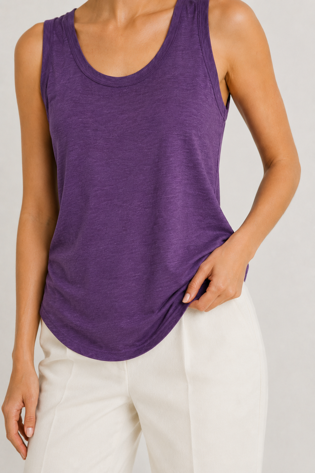 Woman wearing the Lohnr Zarah Tank with a scoop neck and effortless fit