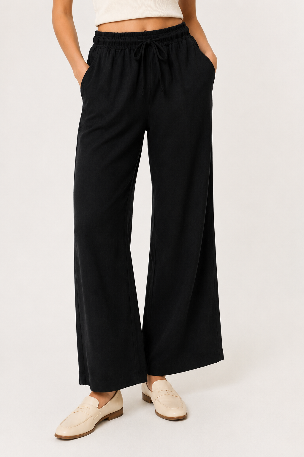 Woman wearing premium minimalist wide leg lounge pants