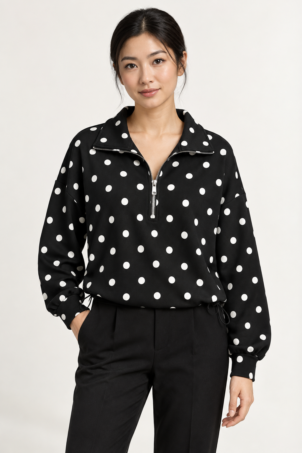 Pippa Polka-Dot Half-Zip in Black, hero view on an adult model. #1A1A1A