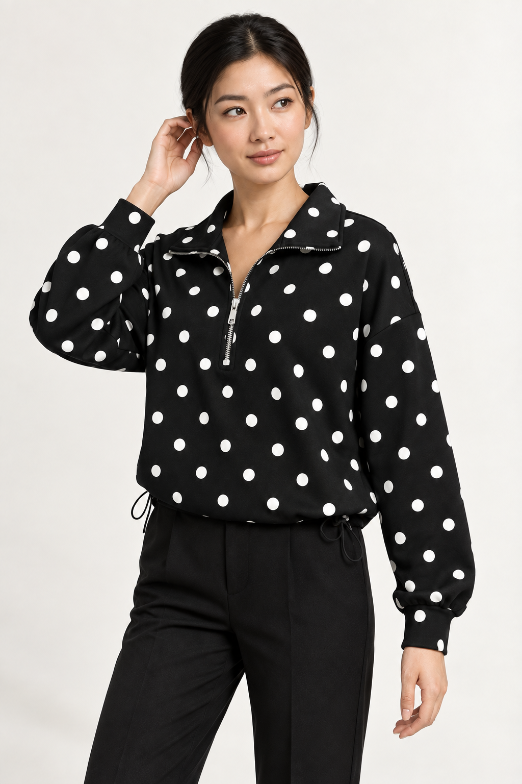 Pippa Polka-Dot Half-Zip in Black, three quarter hair view on an adult model.