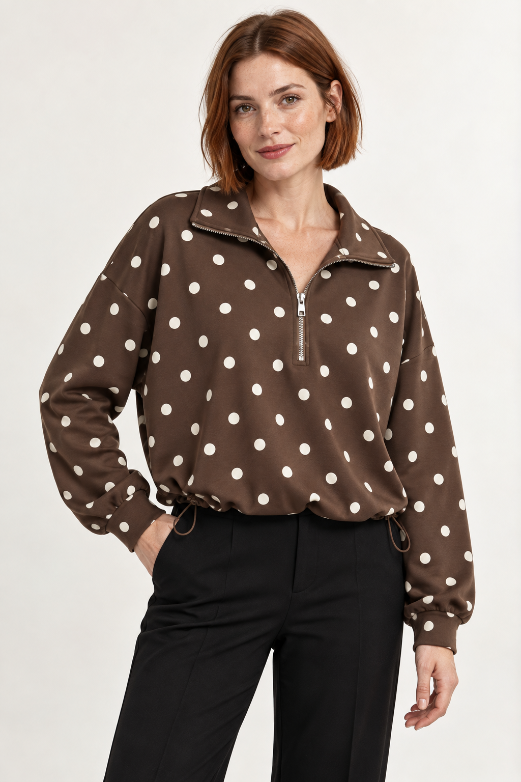 Pippa Polka-Dot Half-Zip in Brown, hero view on an adult model. #503F34