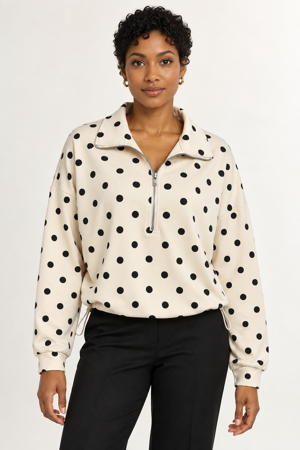 Pippa Polka-Dot Half-Zip in Cream, front hero view on an adult model. #EFEBDD