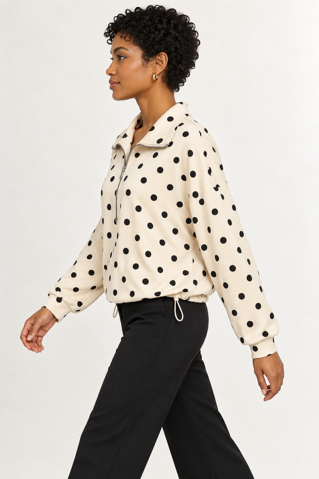 Pippa Polka-Dot Half-Zip in Cream, side stride view on an adult model.