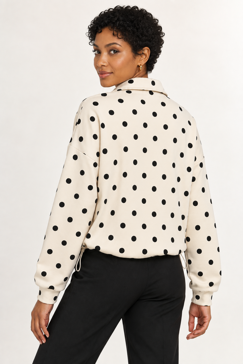 Pippa Polka-Dot Half-Zip in Cream, back glance view on an adult model.