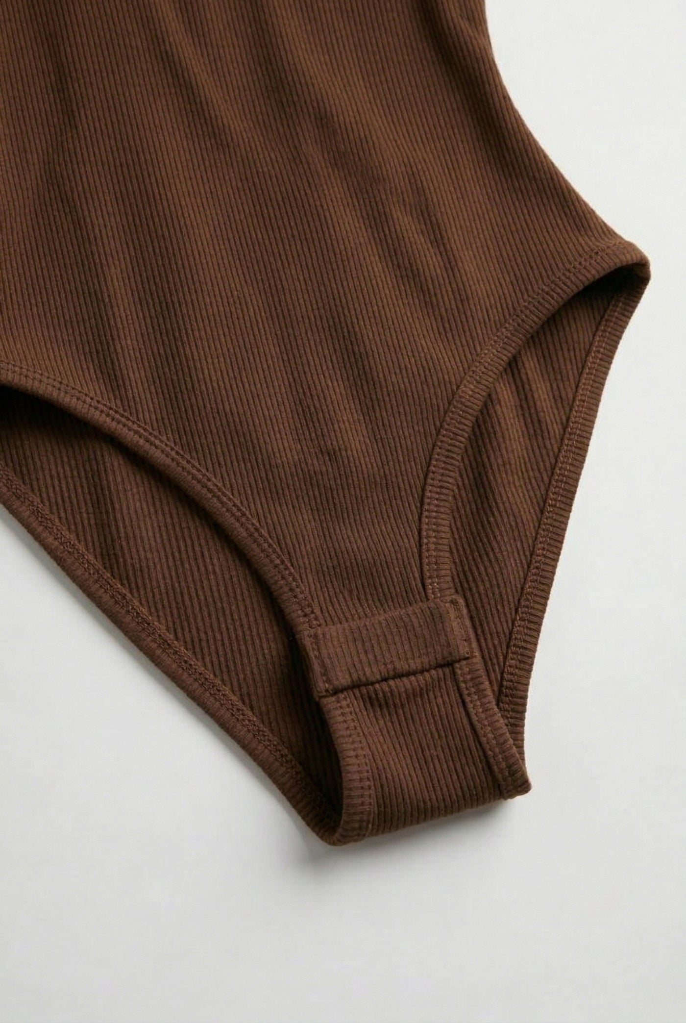 Model wearing a Rich Mocha brown square neck one-piece swimsuit