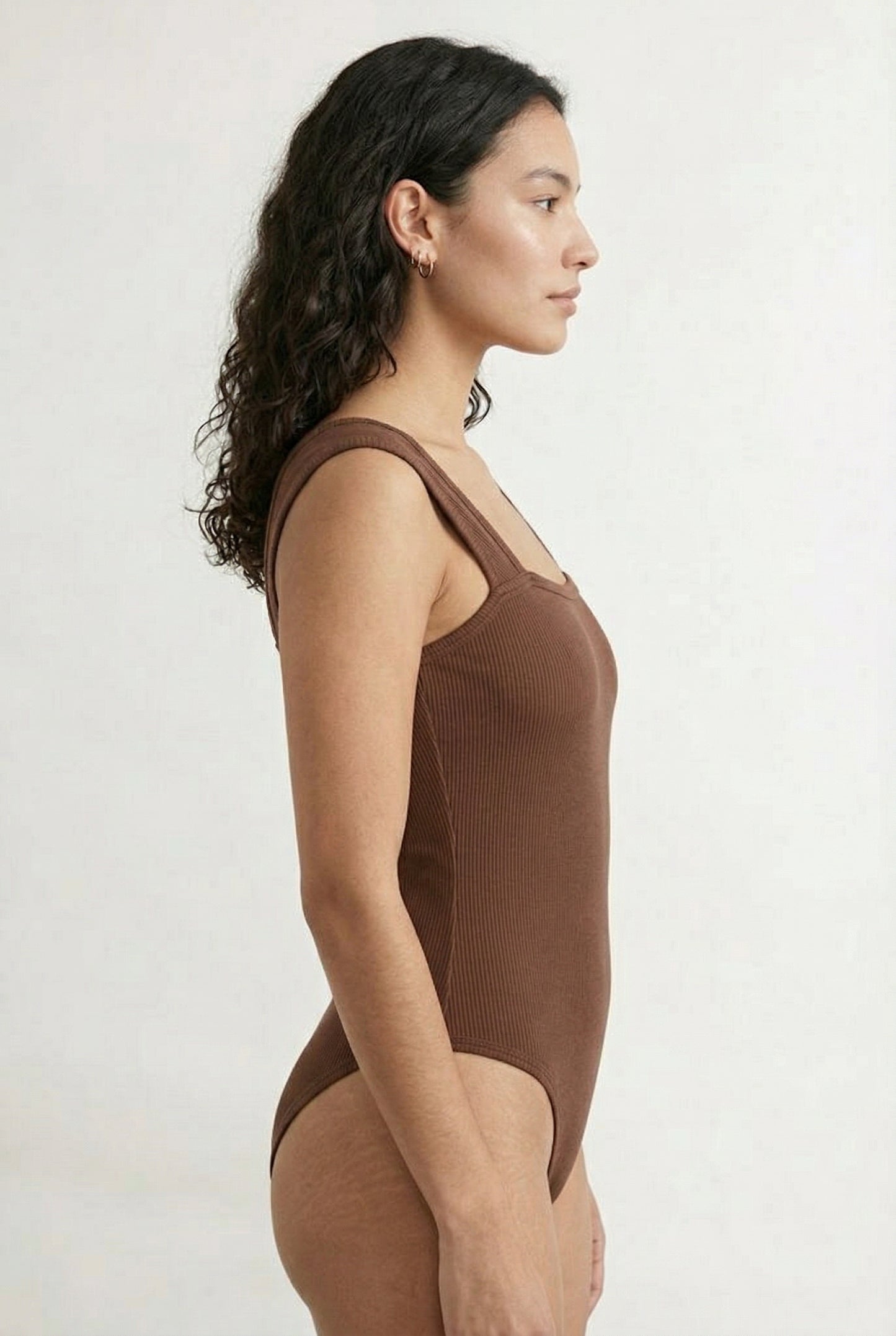 Model wearing a Rich Mocha brown square neck one-piece swimsuit