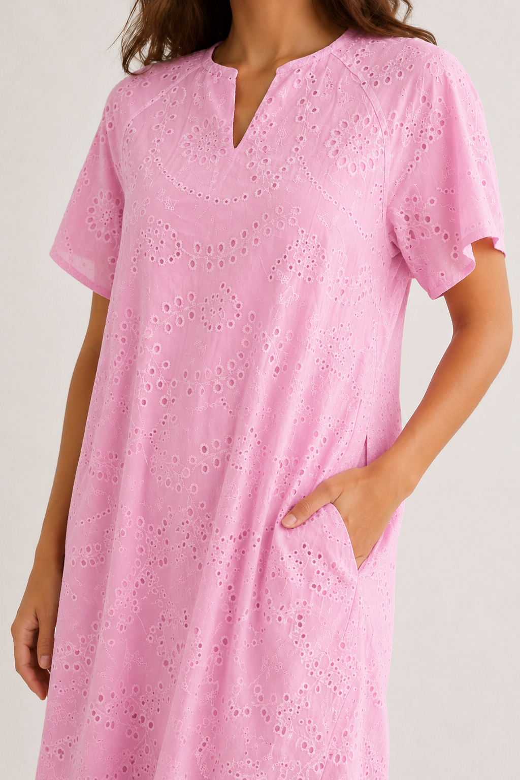 Woman modeling a short-sleeve v-neck midi dress in bright pink Azalea