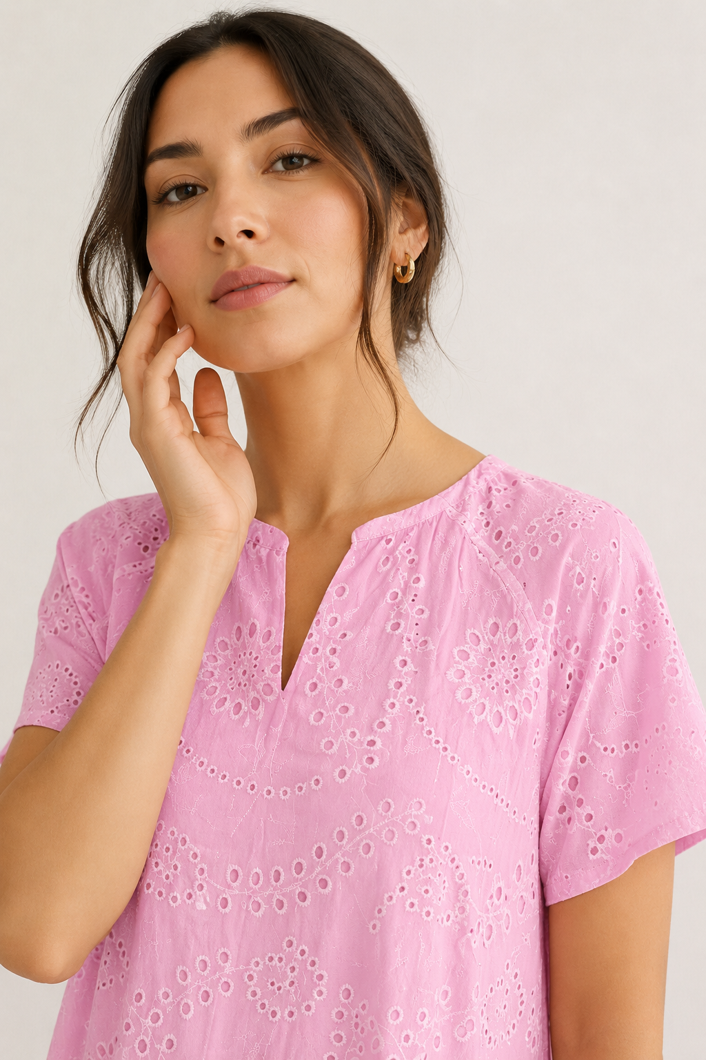 Woman modeling a short-sleeve v-neck midi dress in bright pink Azalea