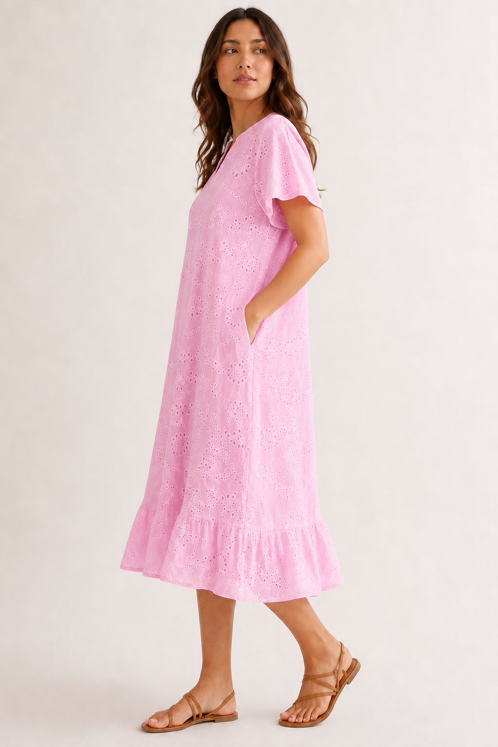 Woman modeling a short-sleeve v-neck midi dress in bright pink Azalea