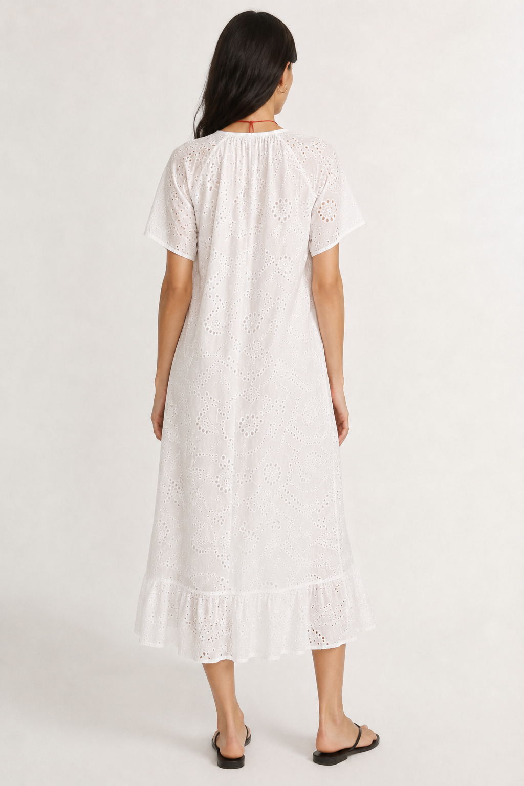 Woman modeling a short-sleeve v-neck midi dress in crisp white Blanc