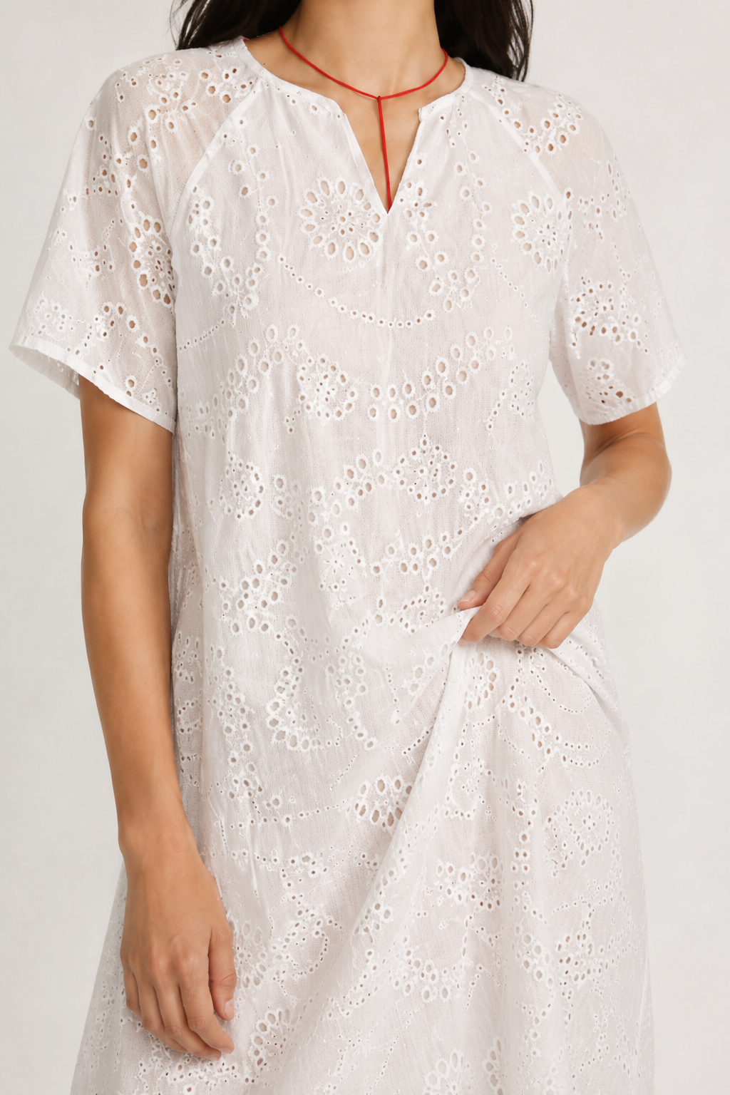 Woman modeling a short-sleeve v-neck midi dress in crisp white Blanc