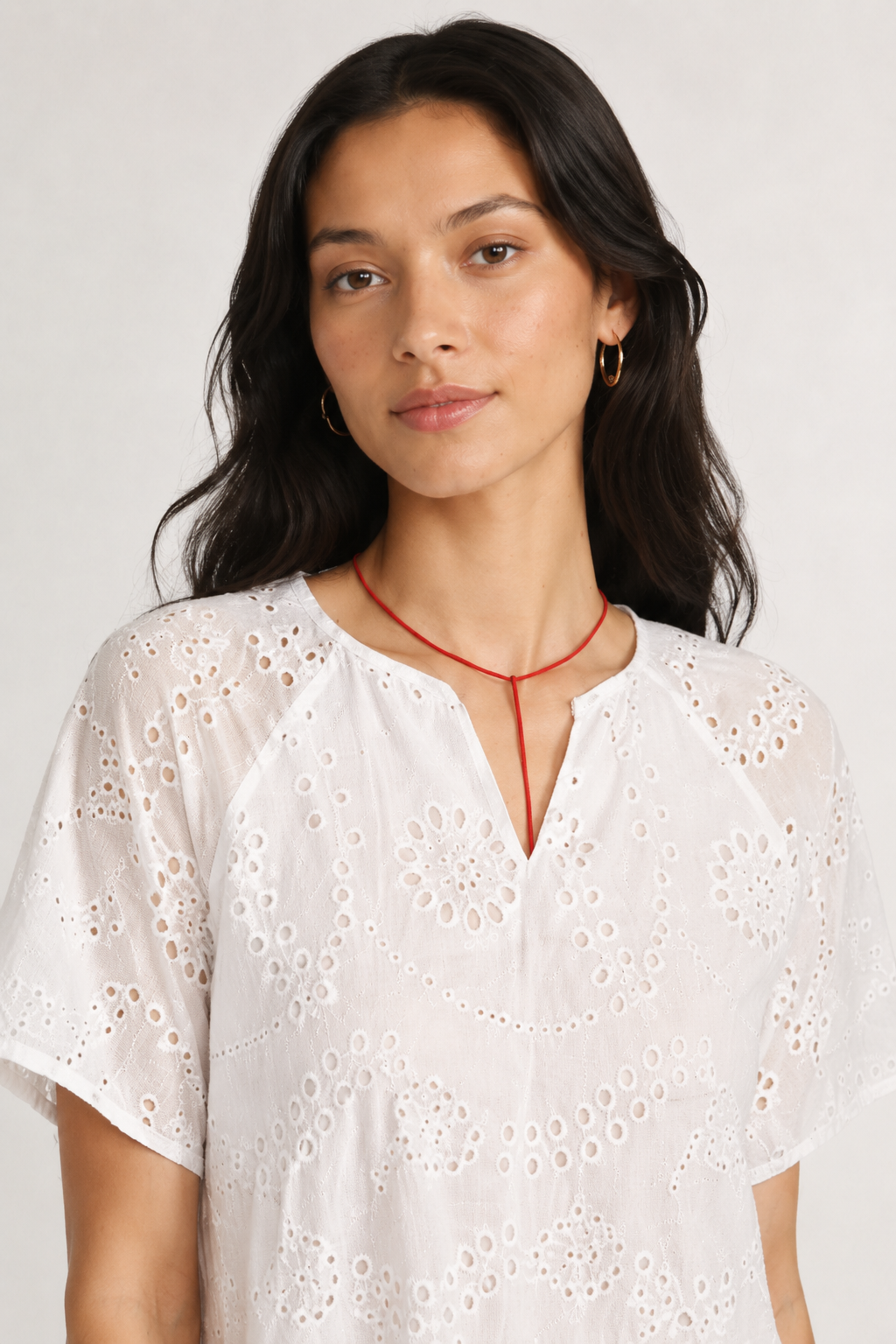 Woman modeling a short-sleeve v-neck midi dress in crisp white Blanc