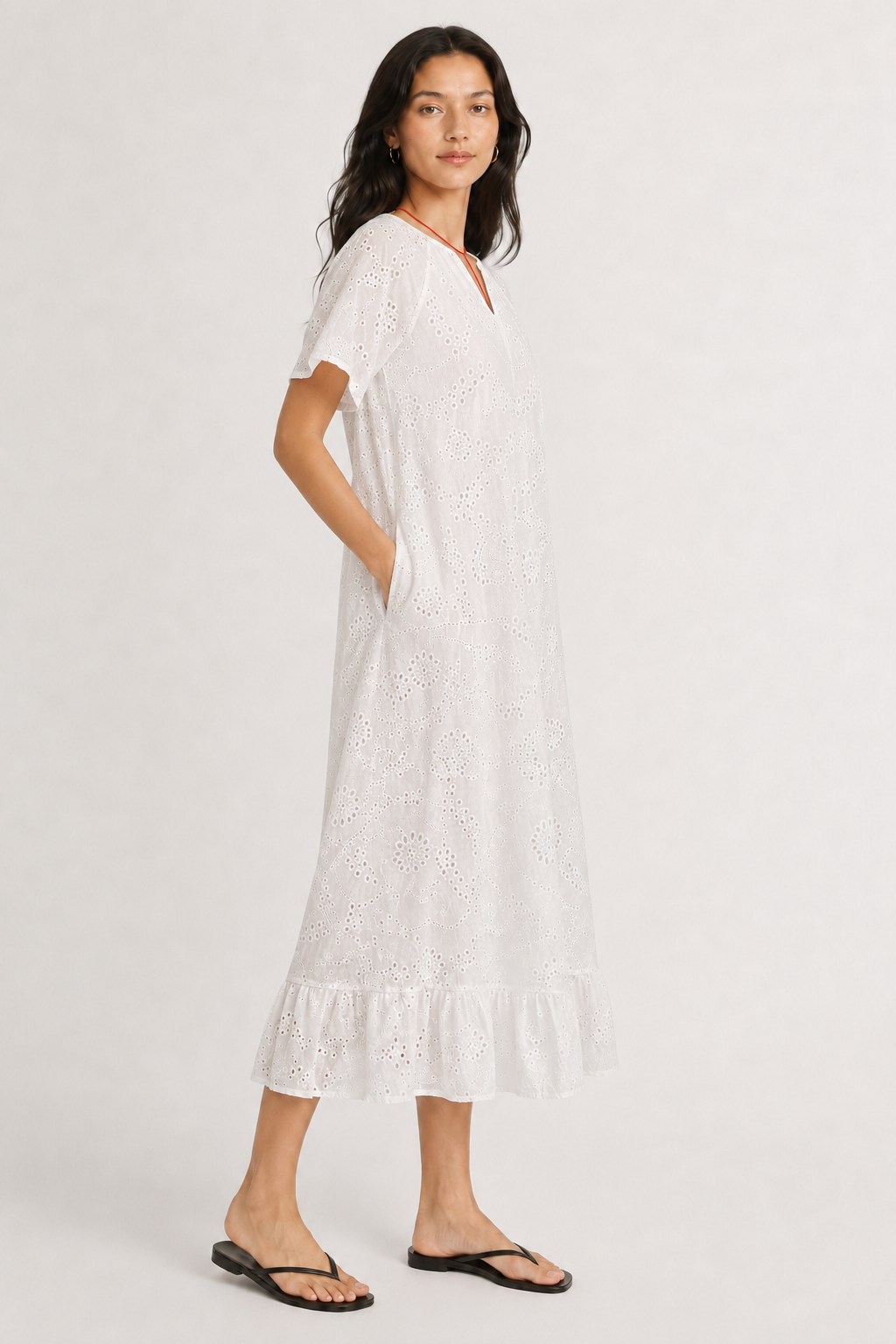 Woman modeling a short-sleeve v-neck midi dress in crisp white Blanc