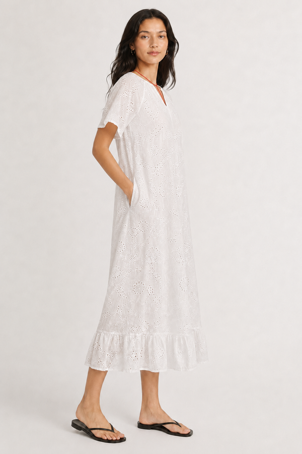 Woman modeling a short-sleeve v-neck midi dress in crisp white Blanc
