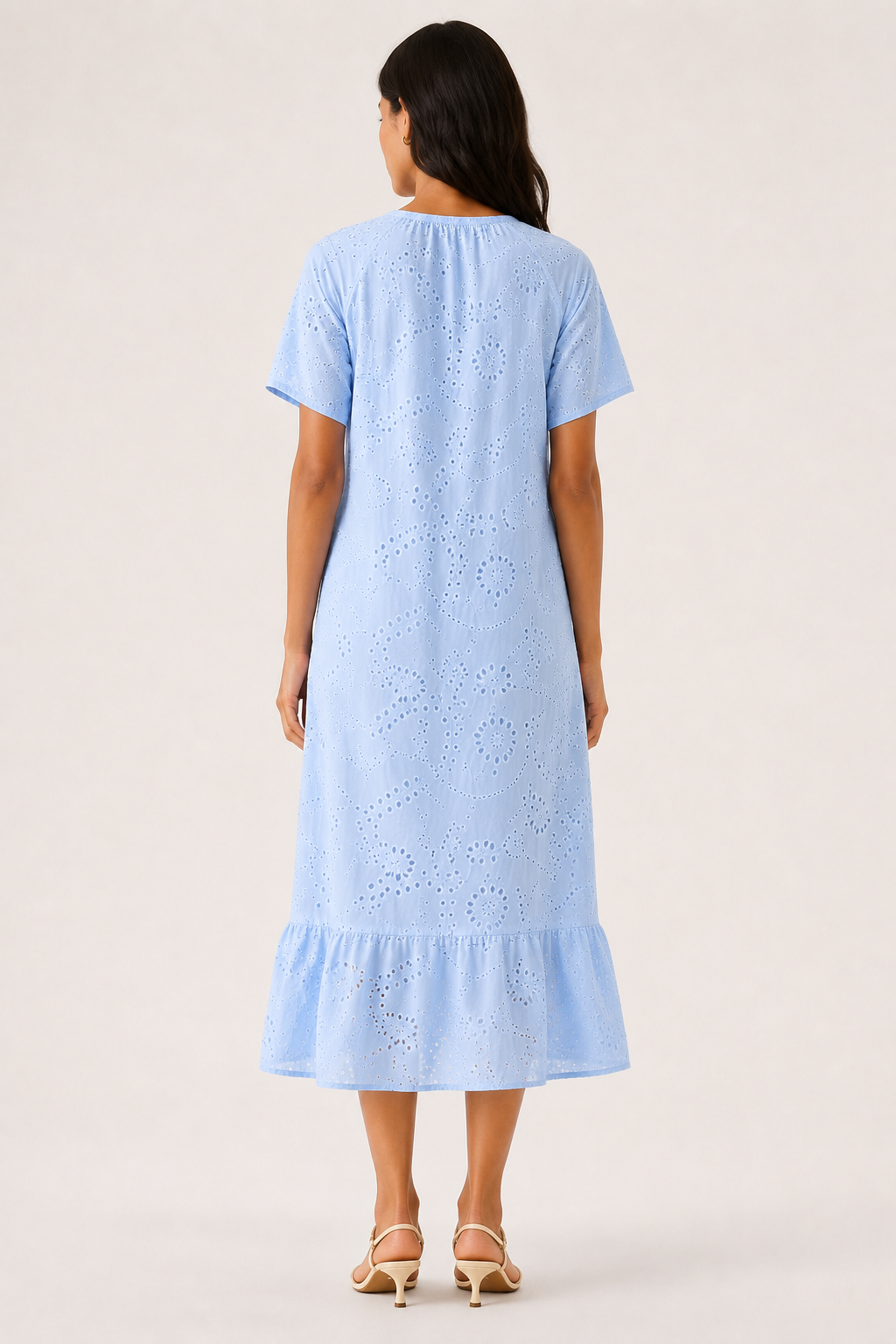 Woman modeling a short-sleeve v-neck midi dress in light blue Celeste
