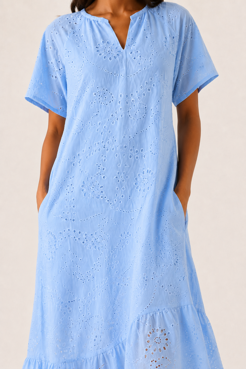 Woman modeling a short-sleeve v-neck midi dress in light blue Celeste