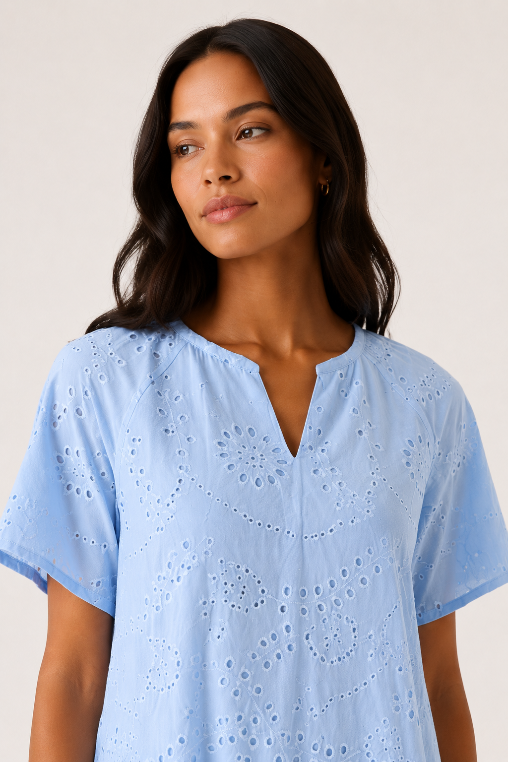 Woman modeling a short-sleeve v-neck midi dress in light blue Celeste