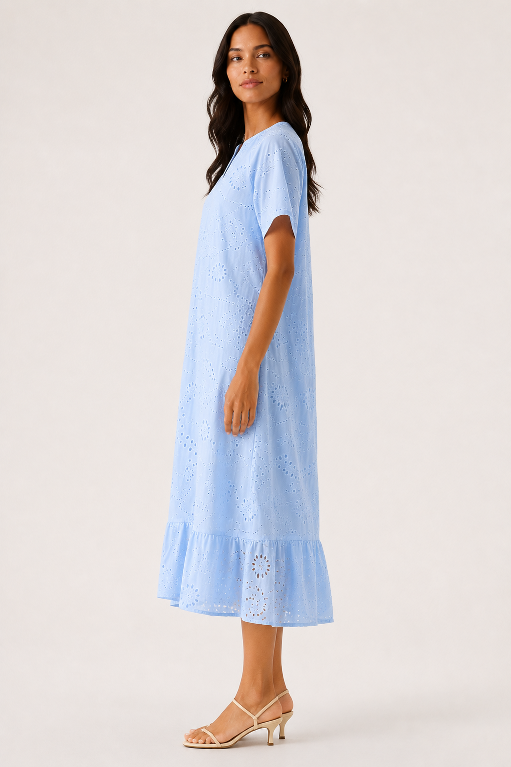 Woman modeling a short-sleeve v-neck midi dress in light blue Celeste