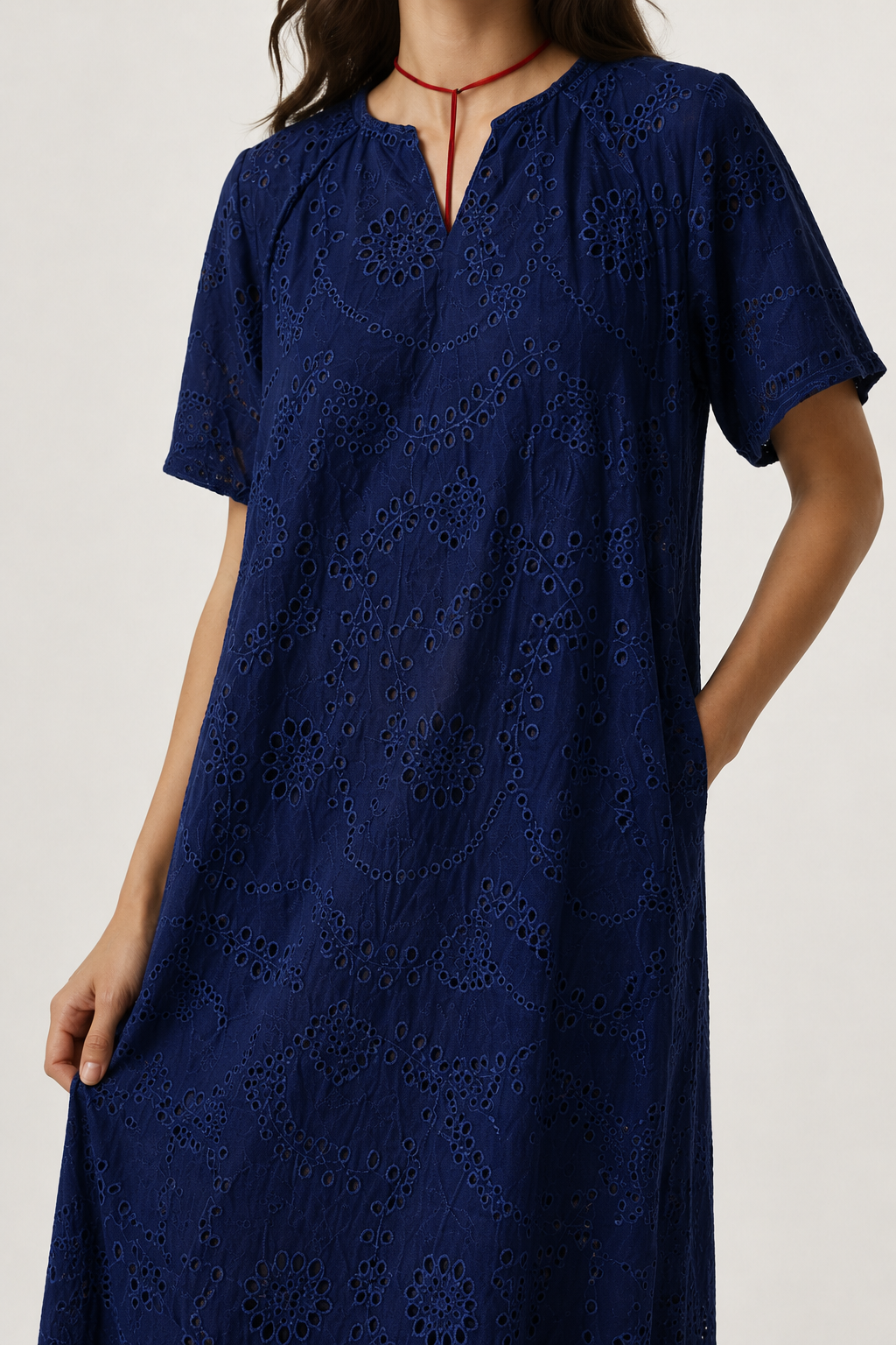 Woman modeling a short-sleeve v-neck midi dress in dark navy Total Eclipse