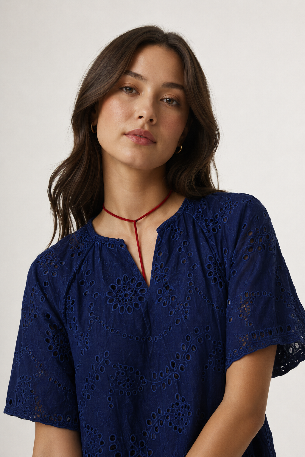 Woman modeling a short-sleeve v-neck midi dress in dark navy Total Eclipse