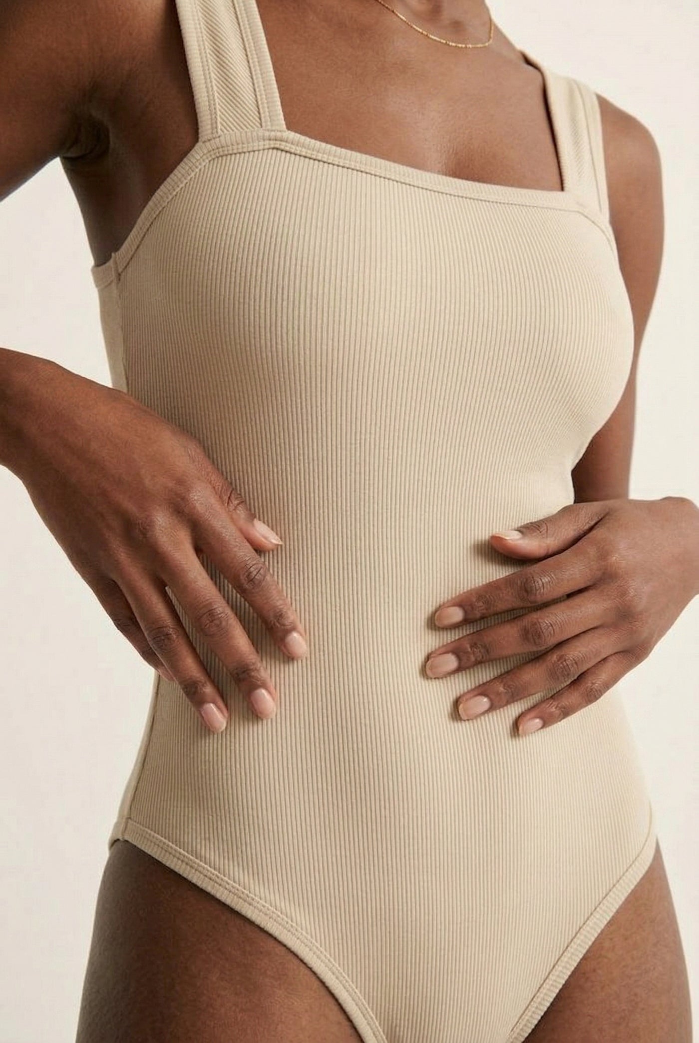 Model wearing an Almond beige square neck one-piece swimsuit