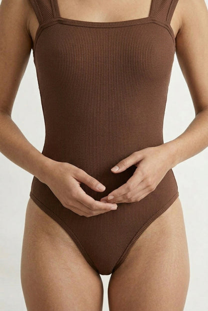 Model wearing a Rich Mocha brown square neck one-piece swimsuit