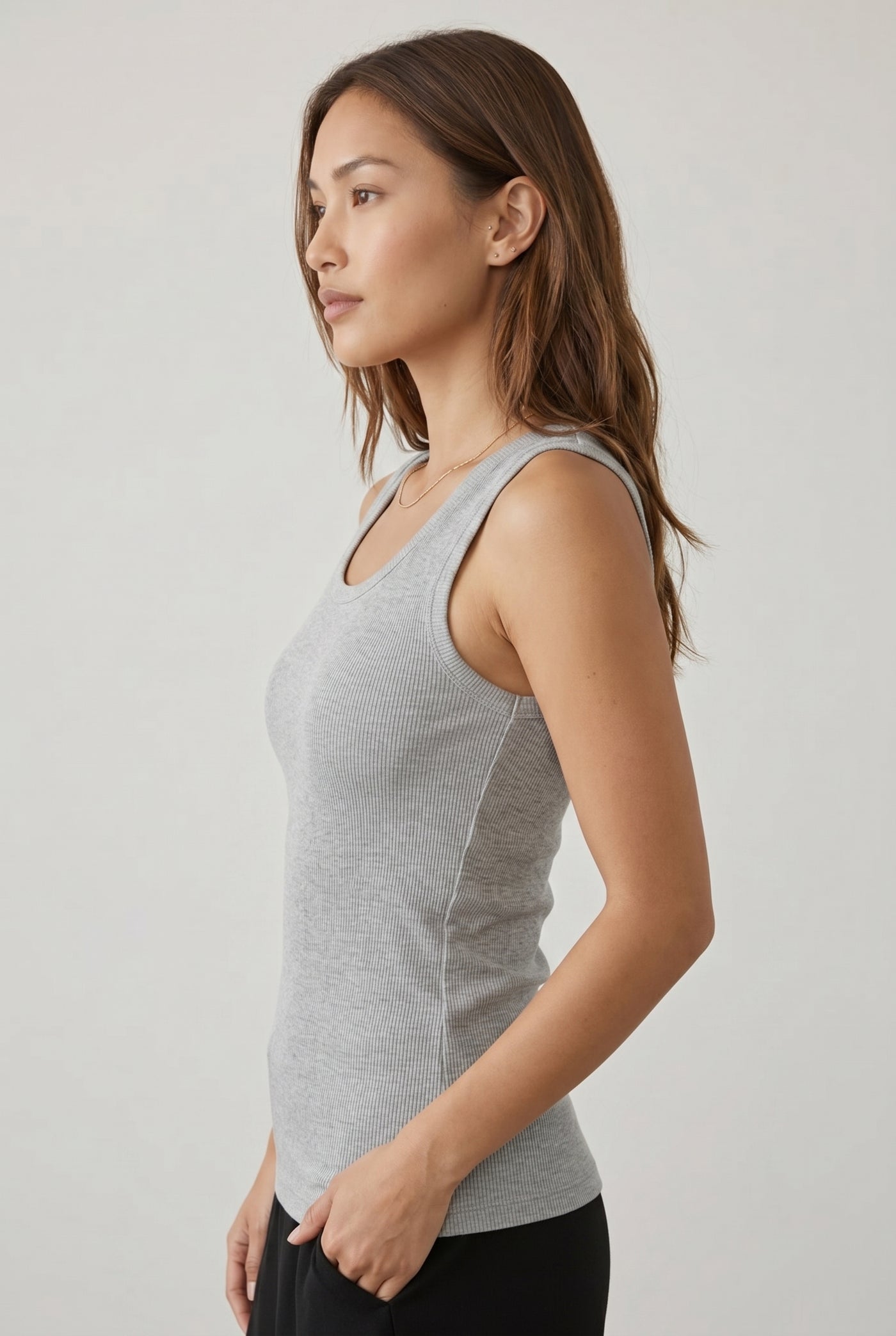 Woman wearing the Staple Scoop Tank in heather grey Ash