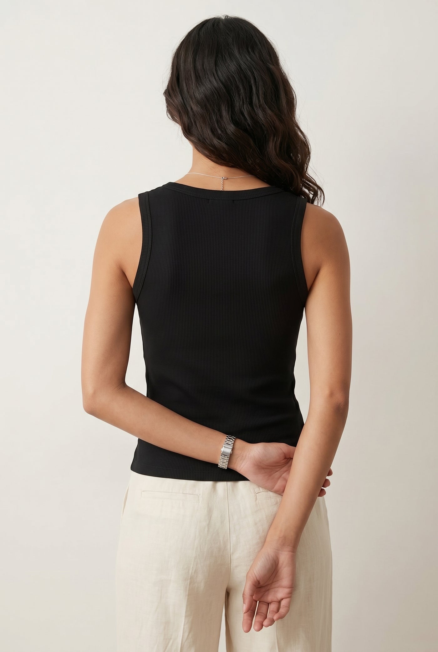 Woman wearing the Staple Scoop Tank in black Onyx