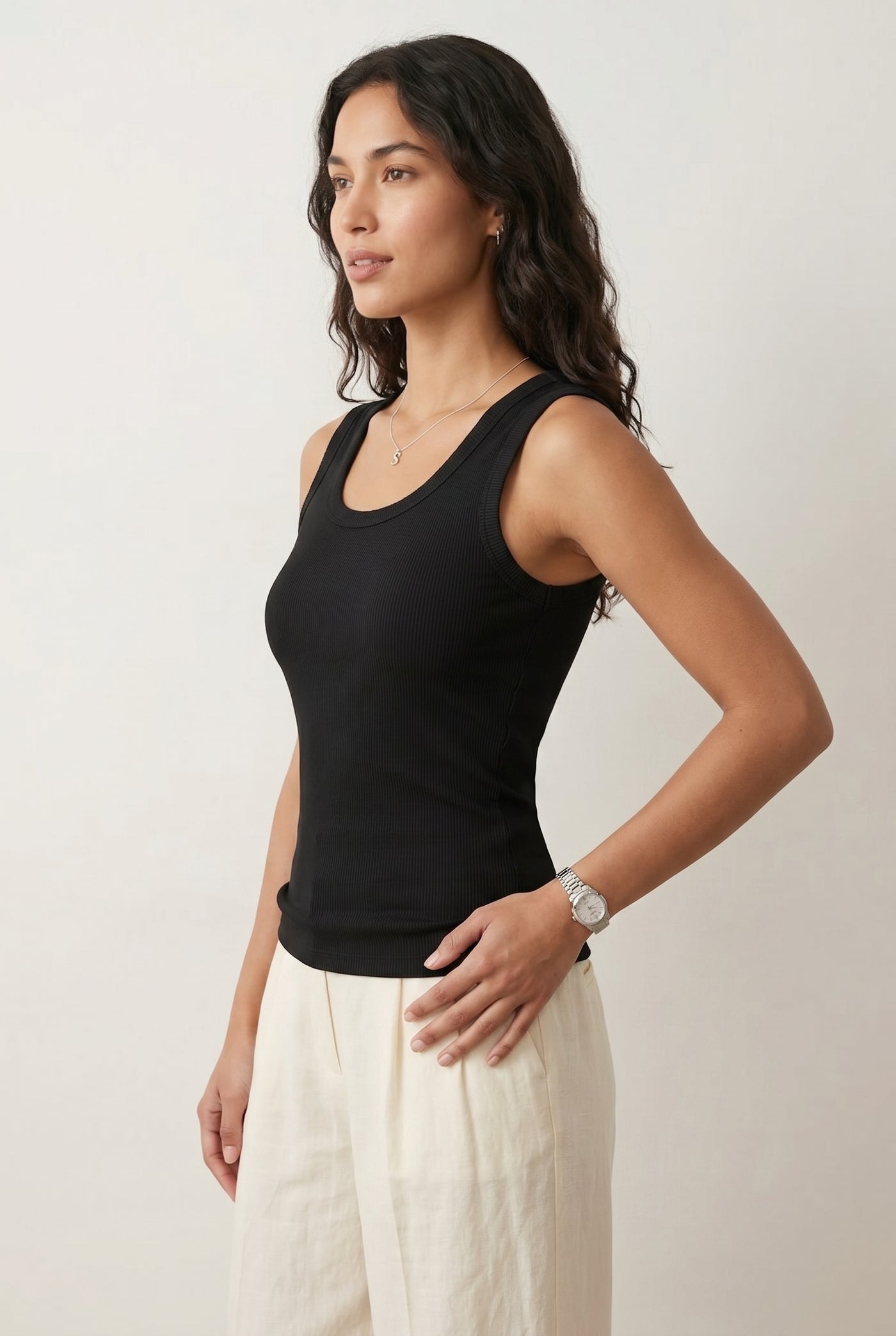 Woman wearing the Staple Scoop Tank in black Onyx