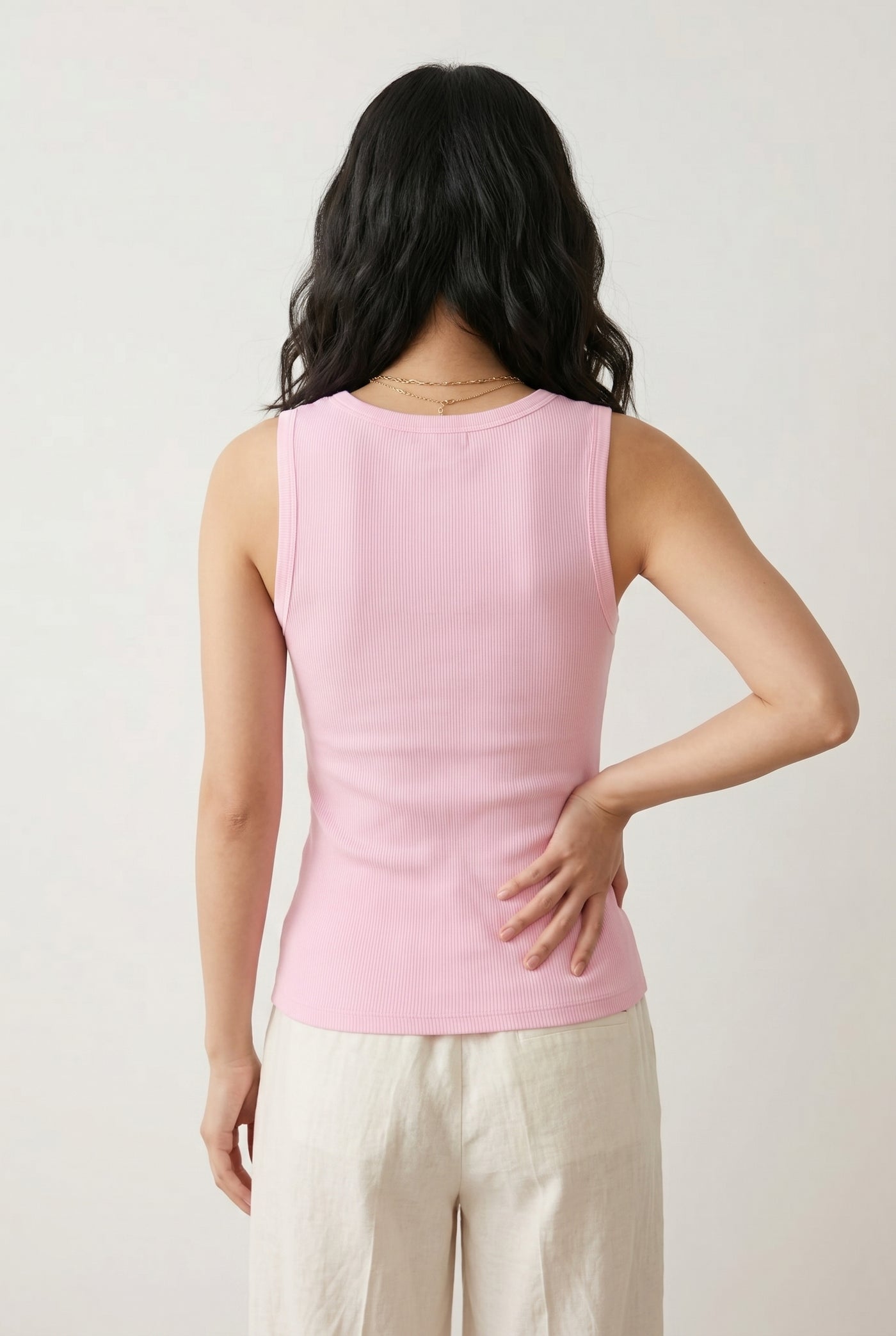 Woman wearing the Staple Scoop Tank in light pink Rosewater