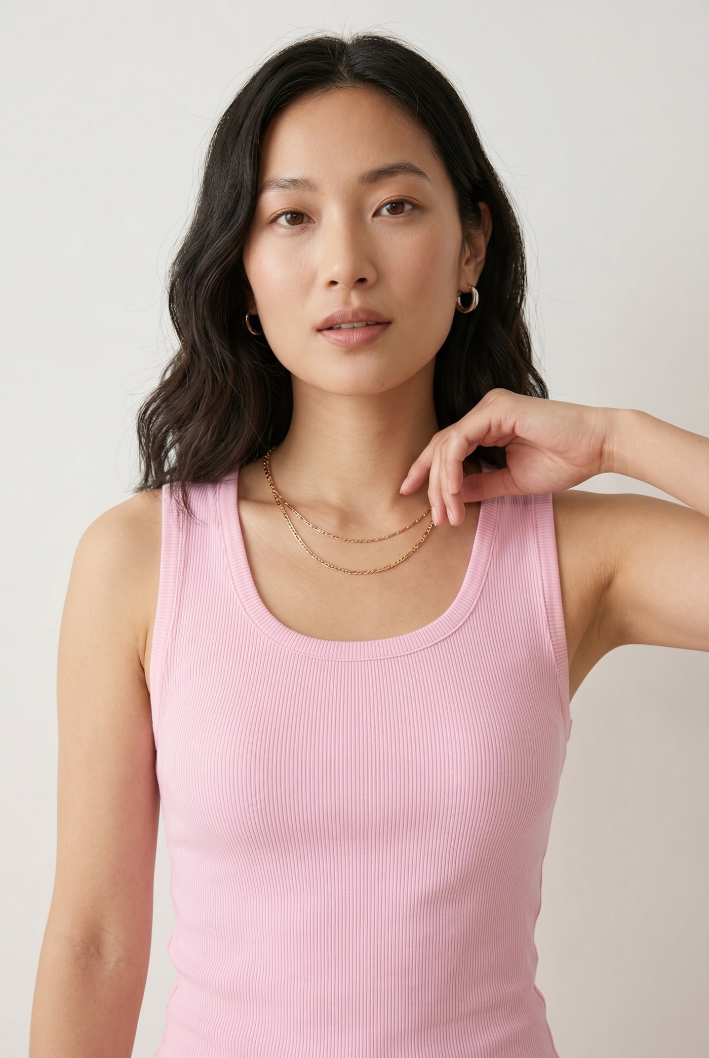 Woman wearing the Staple Scoop Tank in light pink Rosewater