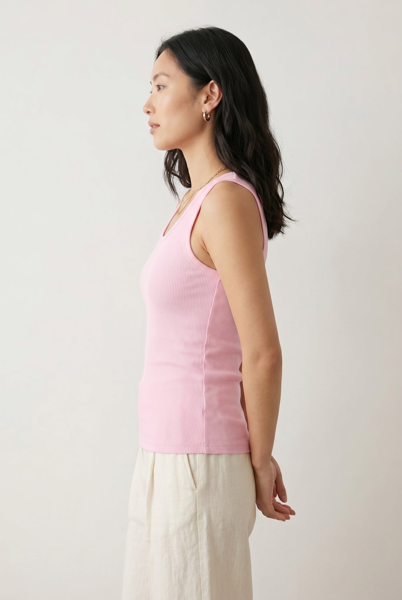 Woman wearing the Staple Scoop Tank in light pink Rosewater