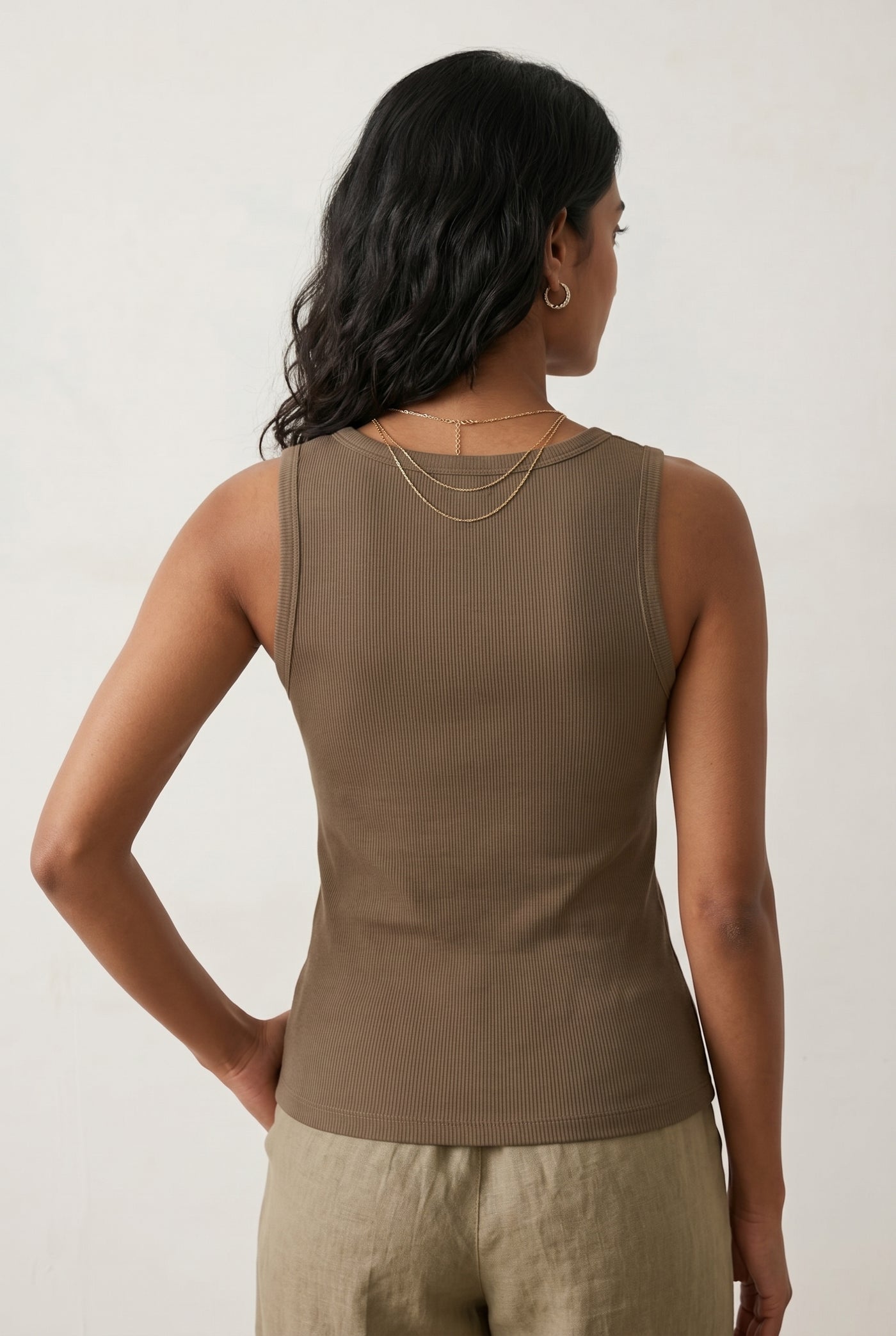 Woman wearing the Staple Scoop Tank in brown Truffle